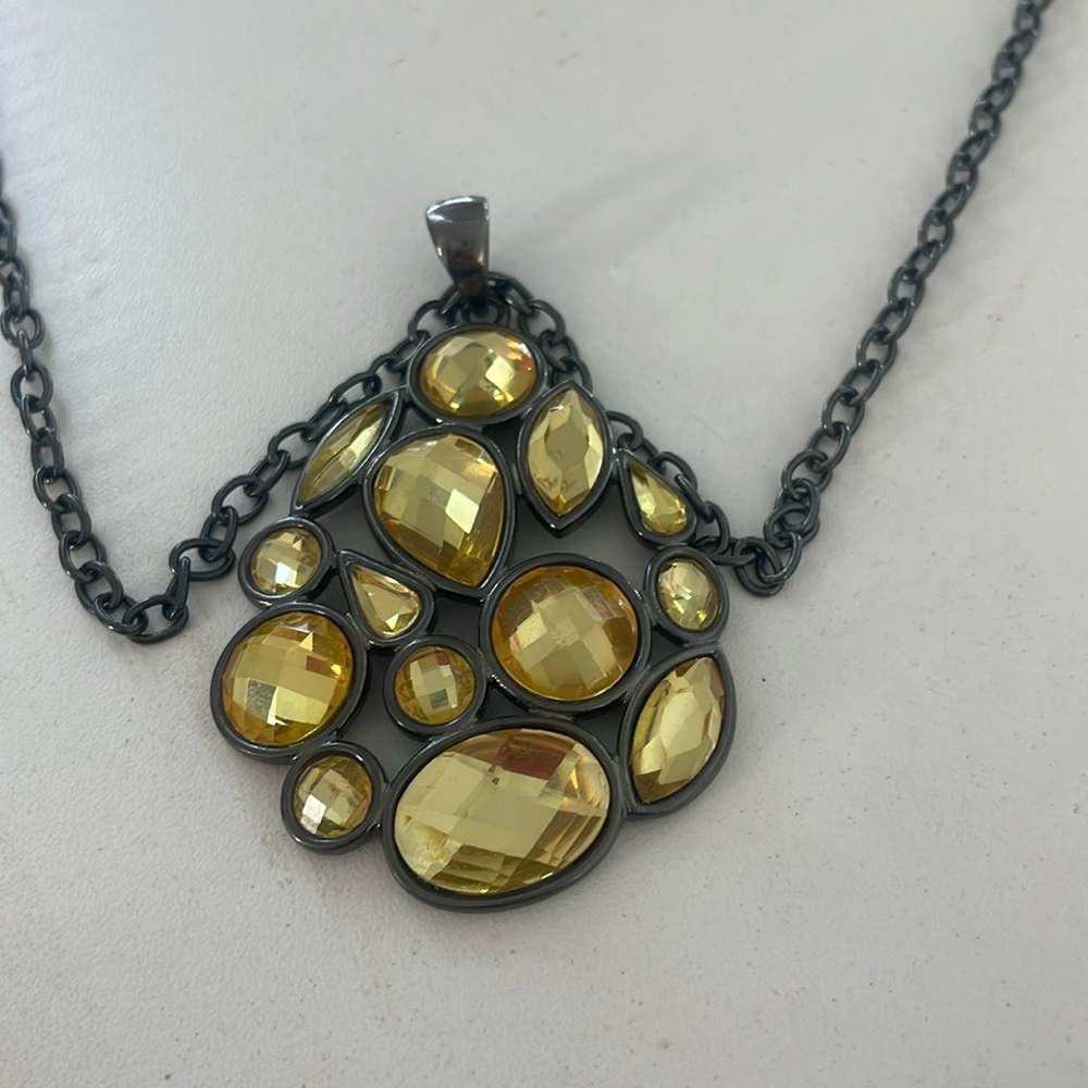 Long yellow gem, black chain necklace